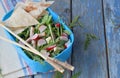 Lunch Box with salad of fresh vegetables - arugula, radish, feta cheese, ham and sesame with flat bread tortilla. Healthy food. Lu Royalty Free Stock Photo