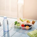 Lunch box with sandwich, vegetables, fruits and bottle of water Royalty Free Stock Photo