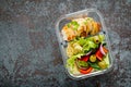 Lunch boxes with grilled chicken breast and pasta salad with fresh vegetables Royalty Free Stock Photo