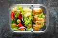 Lunch boxes with grilled chicken breast and pasta salad with fresh vegetables. Top view Royalty Free Stock Photo