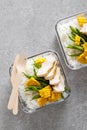 Lunch boxes with grilled chicken breast, rice, corn and green beans. Top view, flat lay Royalty Free Stock Photo