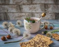 Lunch with cereal biscuits and round caramen, tea in a ceramic mug with dandelion painted Royalty Free Stock Photo