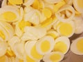 Closeup of dozens of sliced eggs for egg salad sandwiches at the soup kitchen, feeding the hungry