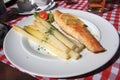 Lunch in the garden - fried fish fillet, asparagus Royalty Free Stock Photo