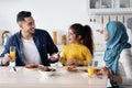 Lunch At Home. Happy Muslim Family Of Three Having Meal Together Royalty Free Stock Photo