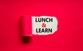 Lunch and learn symbol. Words `Lunch and learn` appearing behind torn purple paper. Beautiful purple background. Business,