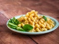 Lunch with pasta with minced meat and mugs of fresh orurtsa on a light green plate Royalty Free Stock Photo