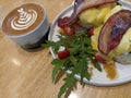 Lunch on plate. With cup of coffee late, pork slices, mozzarella Cheese on burger bread and fresh healthy vegetables Royalty Free Stock Photo