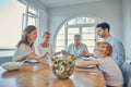 Lunch, praying and family together at dining room table in home. Grandparents, child and parent teaching grace or Royalty Free Stock Photo