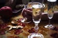 Lunch Provencal style still life with champagne in glasses on table, flower pattern, seasonal vegetables, fruits, daylight. Royalty Free Stock Photo