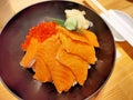 Lunch of raw fish meal on rice in restaurant. Royalty Free Stock Photo