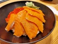 Lunch of raw fish meal on rice in restaurant. Royalty Free Stock Photo