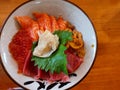 Lunch of raw fish meal on rice in restaurant. Royalty Free Stock Photo