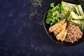 Lunch salad. Buddha bowl with buckwheat porridge, grilled chicken fillet, corn salad, microgreens and daikon. Healthy food. Top Royalty Free Stock Photo
