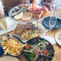 lunch served with seafood platter on tiered stand on table at a restaurant Royalty Free Stock Photo