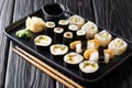 Lunch set Japanese sushi rolls with seafood, vegetables, tofu and tamago closeup on a plate. horizontal Royalty Free Stock Photo