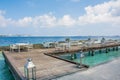 Lunch setup with tables and chairs at the tropical beach Royalty Free Stock Photo