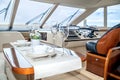 Lunch table setting on a yacht interior comfortable Royalty Free Stock Photo