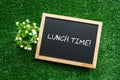 LUNCH TIME! text in white chalk handwriting on a blackboard Royalty Free Stock Photo
