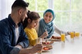 Lunch Together. Islamic Parents And Little Daughter Enjoying Tasty Food In Kitchen Royalty Free Stock Photo