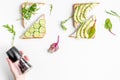 Lunch with triangle sandwiches on white table background top view mockup