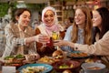 Lunch. Young Women In Cafe Portrait. Group Of Smiling Multiethnic Girls Cheering With Cocktails.