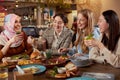 Lunch. Young Women Eating In Cafe. Group Of Smiling Multiethnic Girls Having Breakfast And Talking.