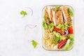 Lunchbox. Lunch box with grilled chicken fillet and pasta salad with fresh vegetables.