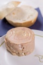 Luncheon meat on the plate with bread in the background Royalty Free Stock Photo