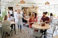 Lunchtime customers eating at a busy restaurant