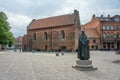 Lund, Sweden - June 9, 2022: Statue infront of old library building