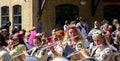 Lund, Sweden - May 19, 2018: Some women students playing the flute as they participate in the parade called Lundakarnevalen