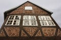 Luneburg, Germany - 10.12.2017: Traditional facades of medieval houses. Decorated for Christmas doors and windows