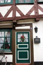 Luneburg, Germany - 10.12.2017: Traditional facades of medieval houses. Decorated for Christmas doors and windows