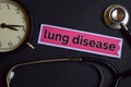 Lung Disease on the print paper with Healthcare Concept Inspiration. alarm clock, Black stethoscope. Royalty Free Stock Photo