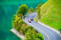 Lungern, canton of Obwalden, Switzerland. The road by the shore of the lake. A lake in a mountain valley. Royalty Free Stock Photo