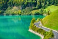 Lungern, canton of Obwalden, Switzerland. The road by the shore of the lake. A lake in a mountain valley. Royalty Free Stock Photo