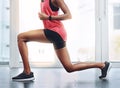 Lunges, fitness and legs of a woman in the gym for wellness, training and health commitment. Strong, cardio and a female Royalty Free Stock Photo