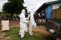 Lunsar, Sierra Leone, July 8, 2015: Buerial team members ready to take a body in a village. ebola response epidemic disease in