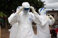 Lunsar, Sierra Leone, July 8, 2015: Buerial team members ready to take a body in a village. ebola response epidemic disease in