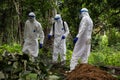 Lunsar, Sierra Leone, June 24, 2015: the burial team disinfects and prepare to burn used equipment. ebola response epidemic