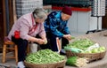 Luo Dai, China: Women Selling Vegetables Royalty Free Stock Photo