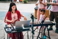 Young woman playing guzheng in the street Royalty Free Stock Photo