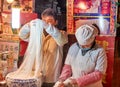 Cooks preparing flour noodles at a street vendor restaurant in Luoyang, China