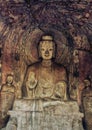 A carved stone Buddha, carved from the rock, Longmen Grottoes an Royalty Free Stock Photo