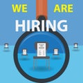 Magnifier glass on chairs with cvs and the text Ã¢â¬Åwe are hiringÃ¢â¬Â