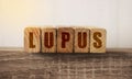 Lupus word written on wooden cubes. Healthcare medical concept Royalty Free Stock Photo