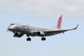 Luqa, Malta 9 January 2015: Niki Embraer 190LR on short finals runway 31. Royalty Free Stock Photo