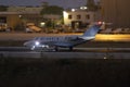 Business Jet landing in low light after sunset Royalty Free Stock Photo