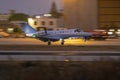 Business Jet landing in low light after sunset Royalty Free Stock Photo